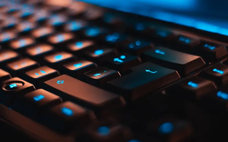 Close-up of a backlit keyboard, the tab key in focus